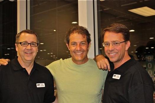 Surf Expo's Roy Turner and Sean O'Brien (in black) with Shaun Tomson