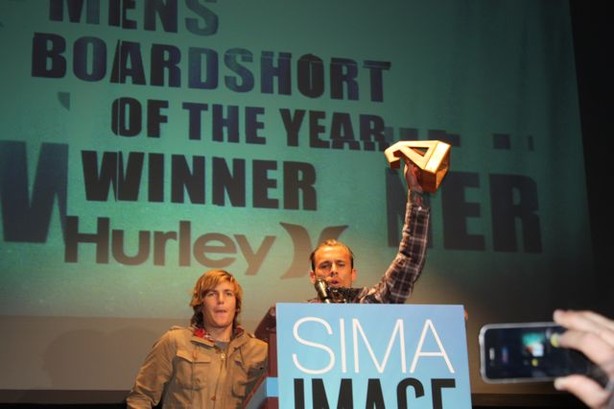 Ryan Hurley (with award) and Carson Wach accept Hurley's award for Men's Boardshort of the Year. It's the third straight win in this category for Hurley.