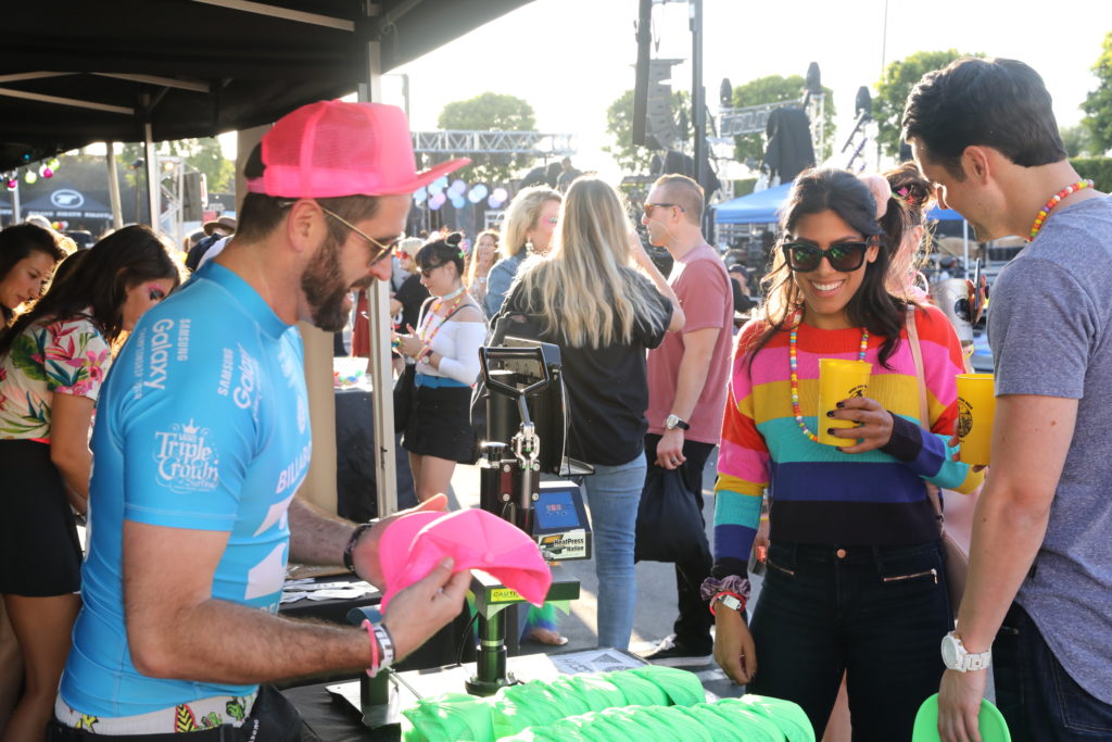 Billabong was customizing neon green and hot pink hats, and they even had a face painter. Mike Wallace from Billabong is pictured.