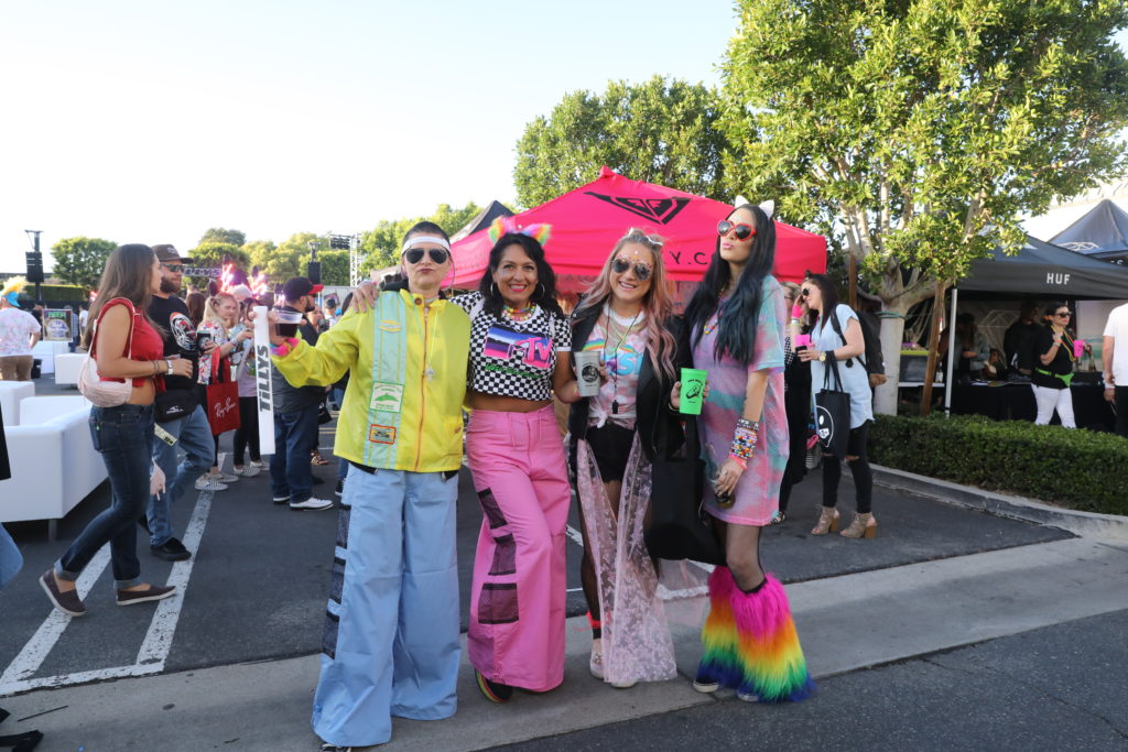 Tillys Visual Ladies, Julie Campbell (VP) and Jen Binkowski looking groovy as ever with their friends.