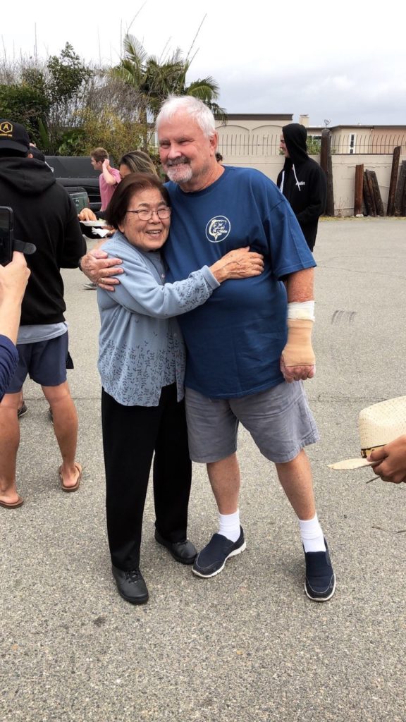 Sato Hughes with very first Katin trunk wearer_surfer Corky Caroll 