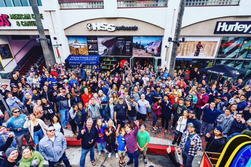 Customers turn out for the annual One Cent Surfboard Sale. As a thank you to customers, HSS raffles off five surfboards. Winners get to choose any shortboard in the store for a purchase price of one cent.