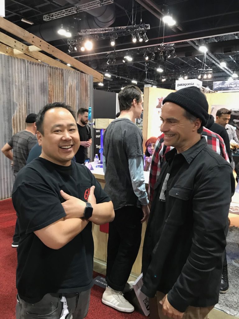 Doug Sumi of 686 and Westlife catching up with Pierre André Senizergues of Sole Tech in the aisle