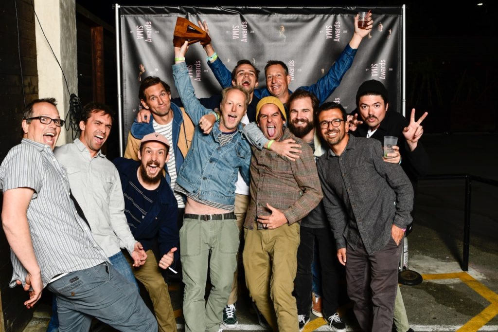 Vissla celebrating the Men's Apparel Brand of the Year win - Photo by Hilleman courtesy of SIMA