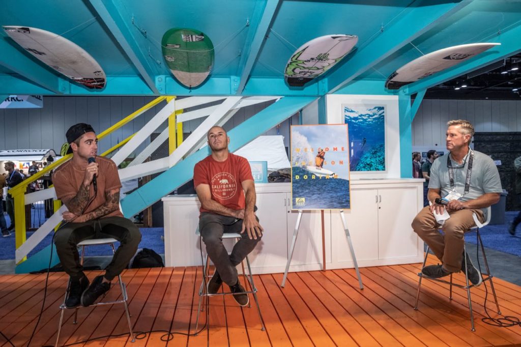 Billy Kemper and Shane Dorian with moderator Scott Bass at the Reef booth