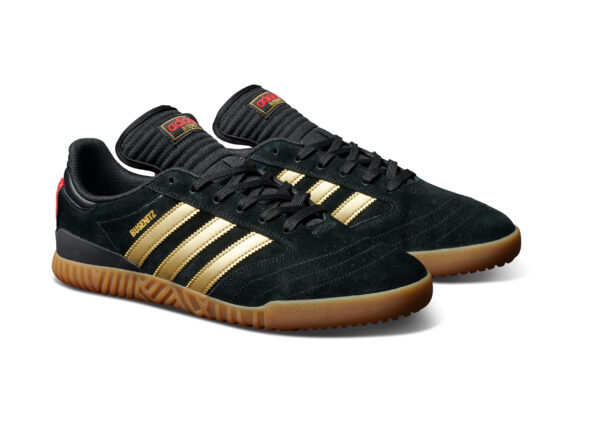 Adi FW21 Busenitz15Year BlackGold OnWhite Hero Front