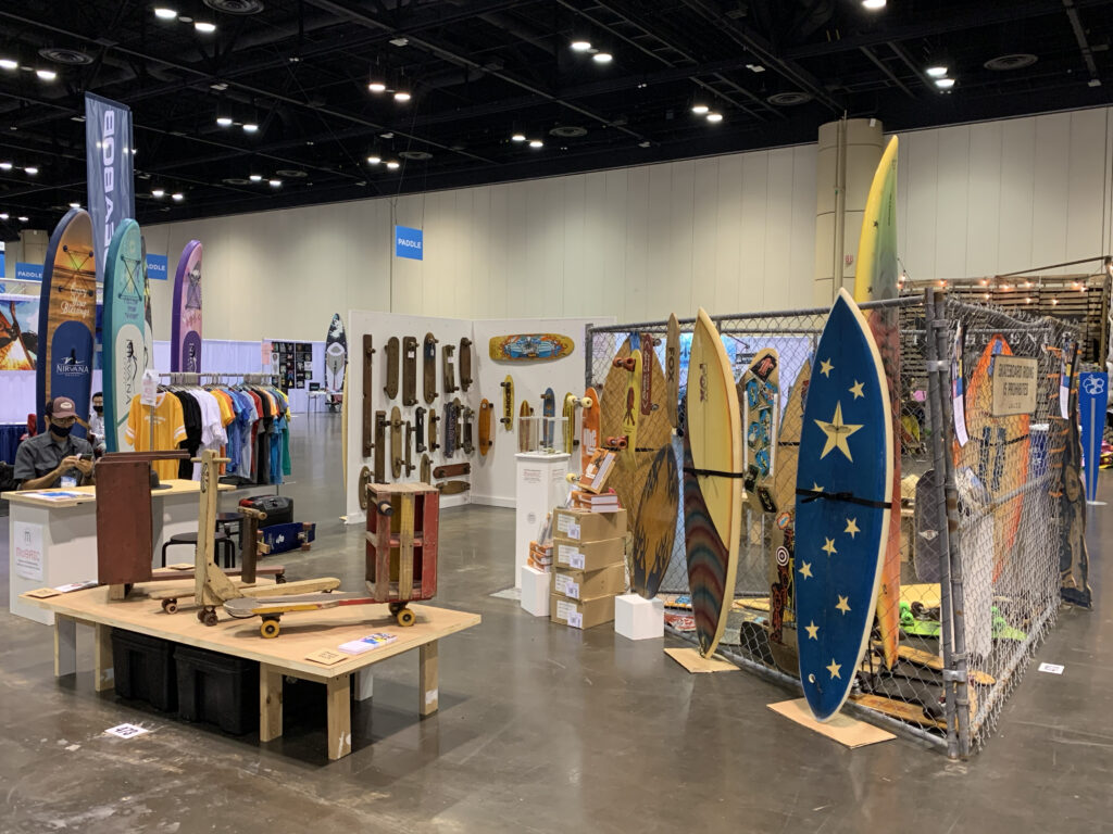 A vintage surf and skateboard display by Mosaic