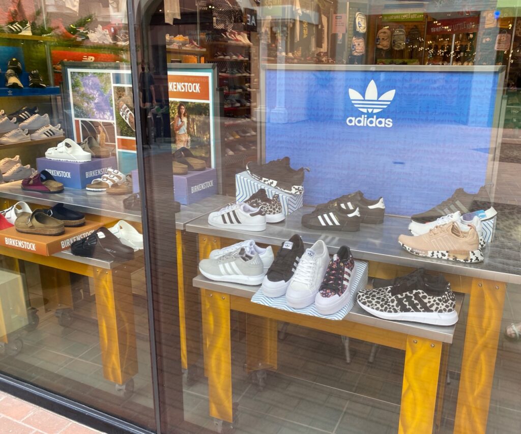 Adidas and Birkenstock in the Journeys window