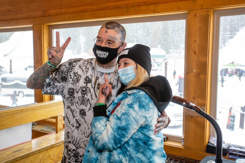 Tattoo artist Kyle Grand and a Zumiez employee with a new tattoo