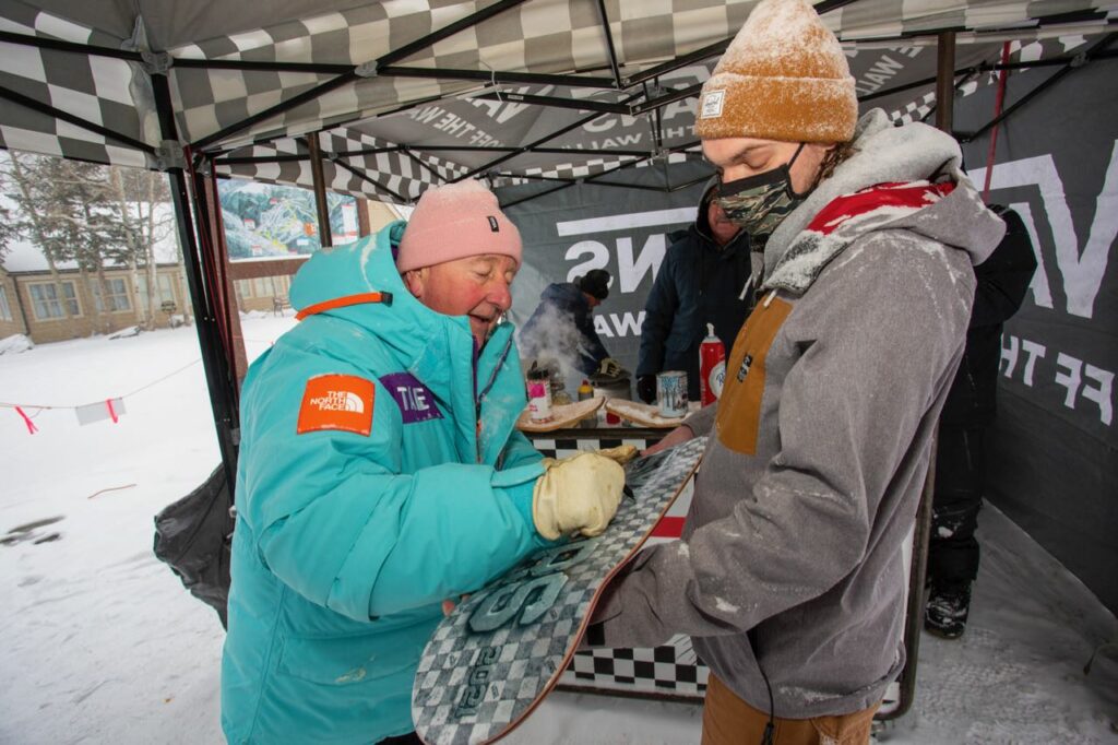 Steve Van Doren of Vans signing autographs while serving waffles 