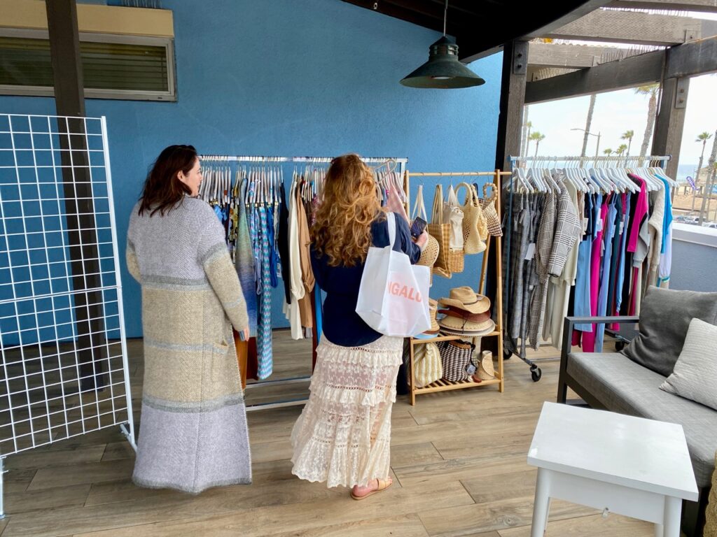 L*Space sales rep Allison Gleason, left, showing the line