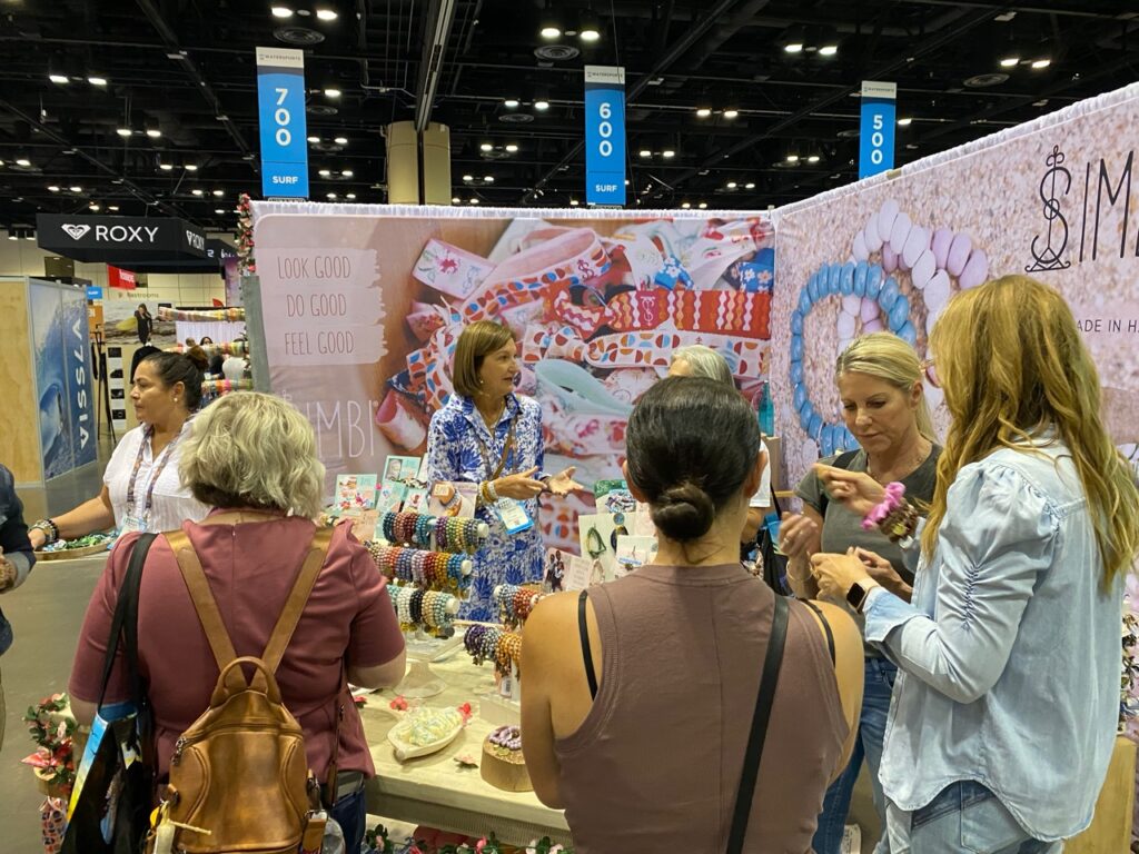 A crowd at the Simbi booth