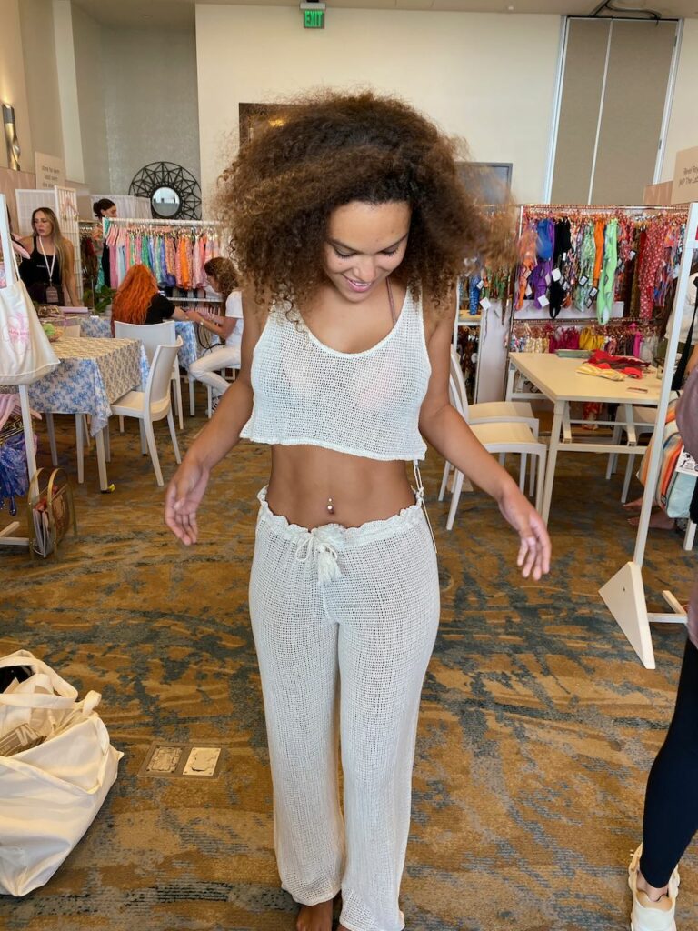 Haley Hart models a Malai coverup for buyers. Photo by SES. 