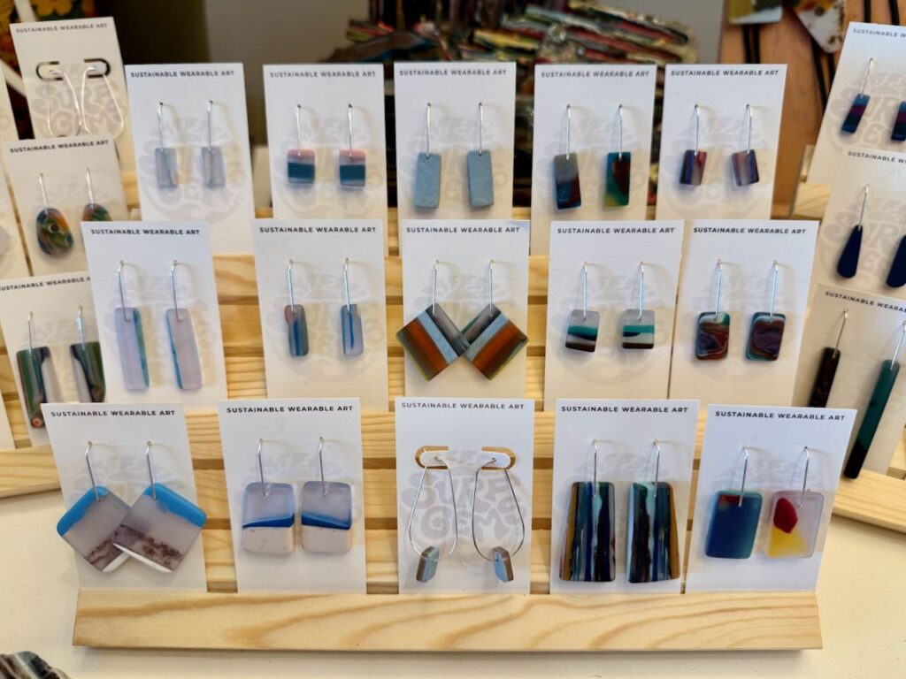 Surf Gems makes colorful jewelry from the resin remnants left behind from surfboard builders. Photo by SESO.